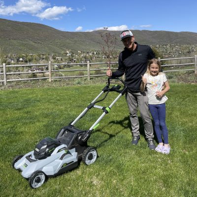 Danny and daughter with electric lawnmower